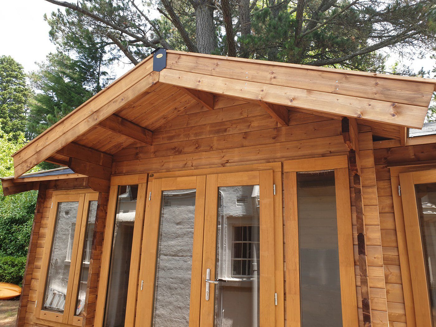 Stained timber kitset cabin au