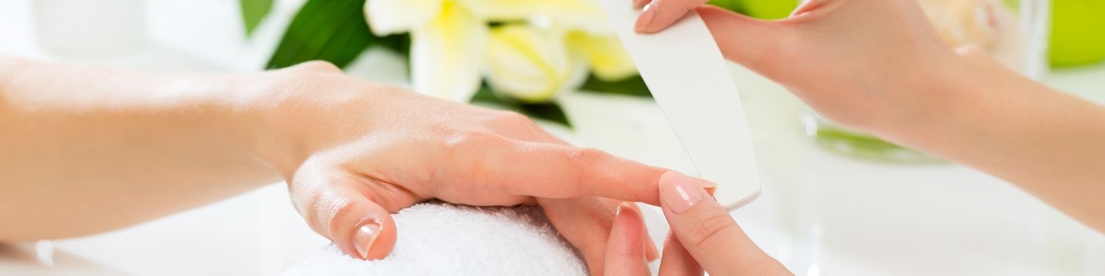 Nail technician working in a kitset cabin studio