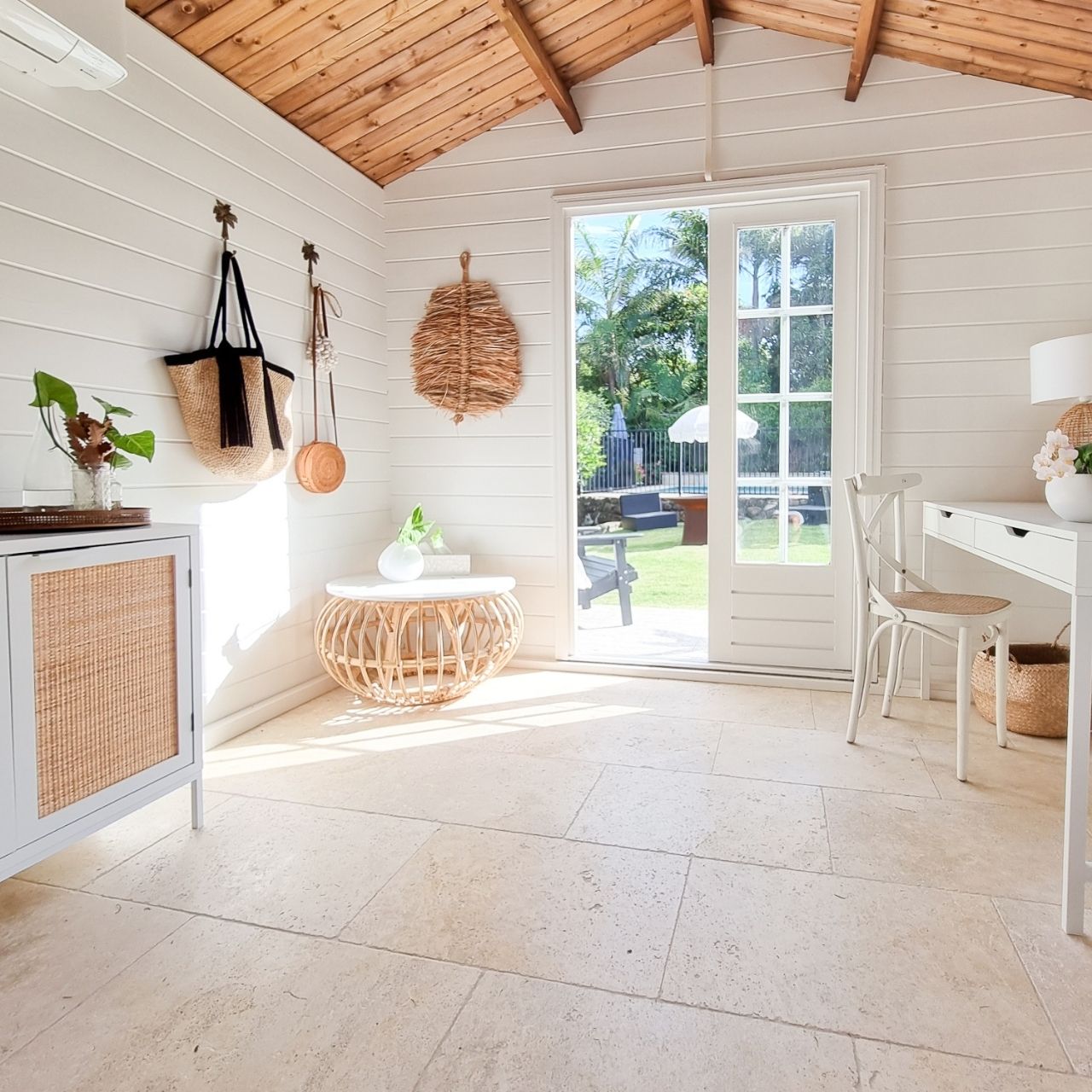 Tiny house with a tiled floor and timber walls
