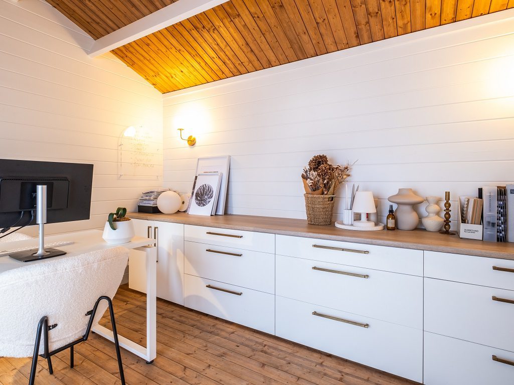 She shed cabin as home office with wall of drawers