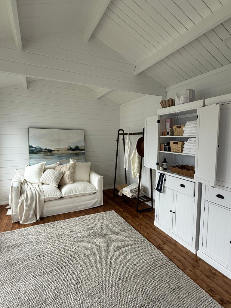 White exposed ceiling, inside brook river she shed cabin.
