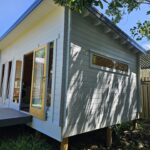 outside of alpine cabin with fixed long window