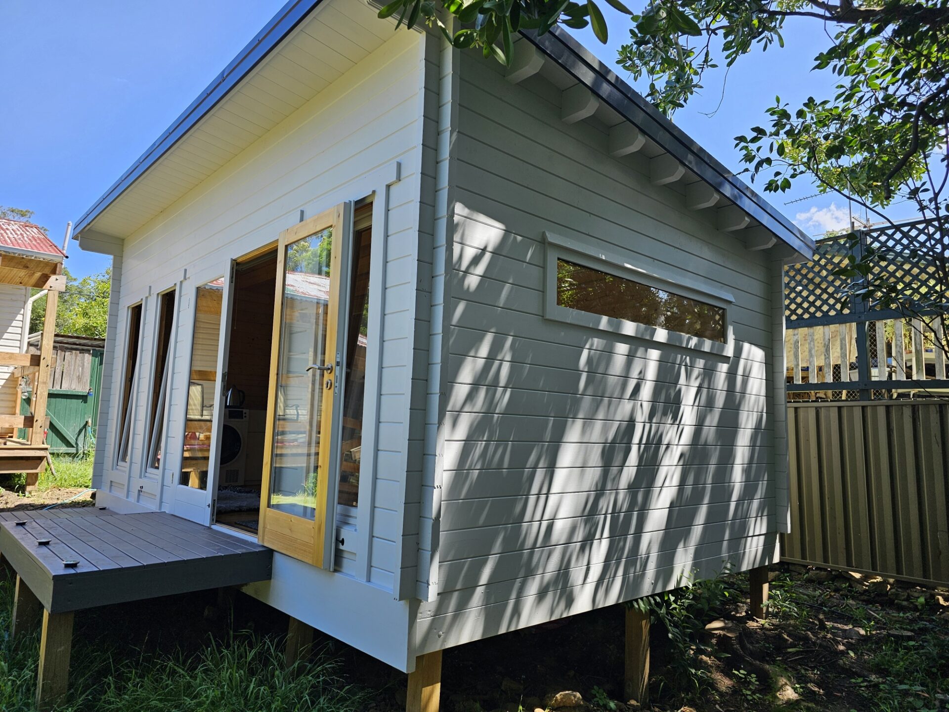 outside of alpine cabin with fixed long window