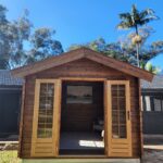 inside of unpainted star cabin display home office with open french doors and steel subframe