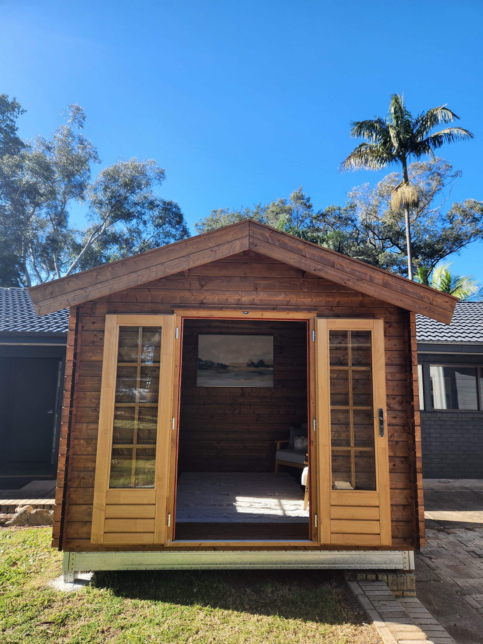 inside of unpainted star cabin display home office with open french doors and steel subframe