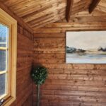 inside of unpainted star cabin display home office with casement window