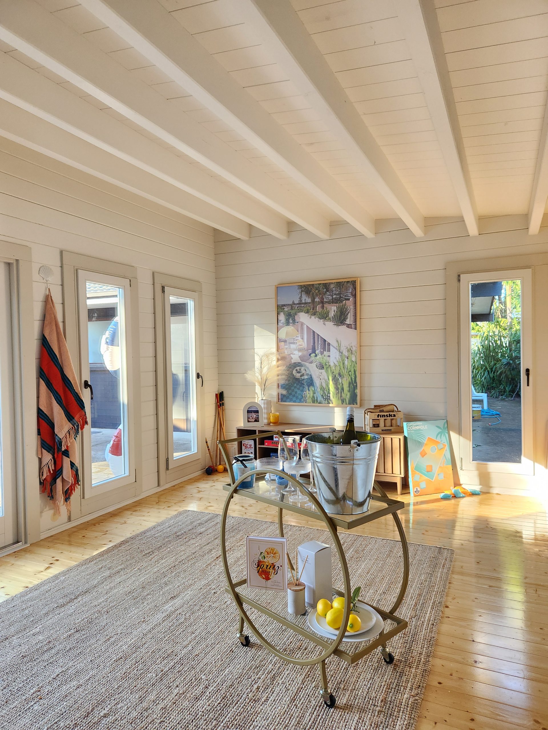 inside of painted poolhouse themed alpine display cabin