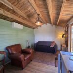 inside woodland cabin used as backyard retreat with pendant light