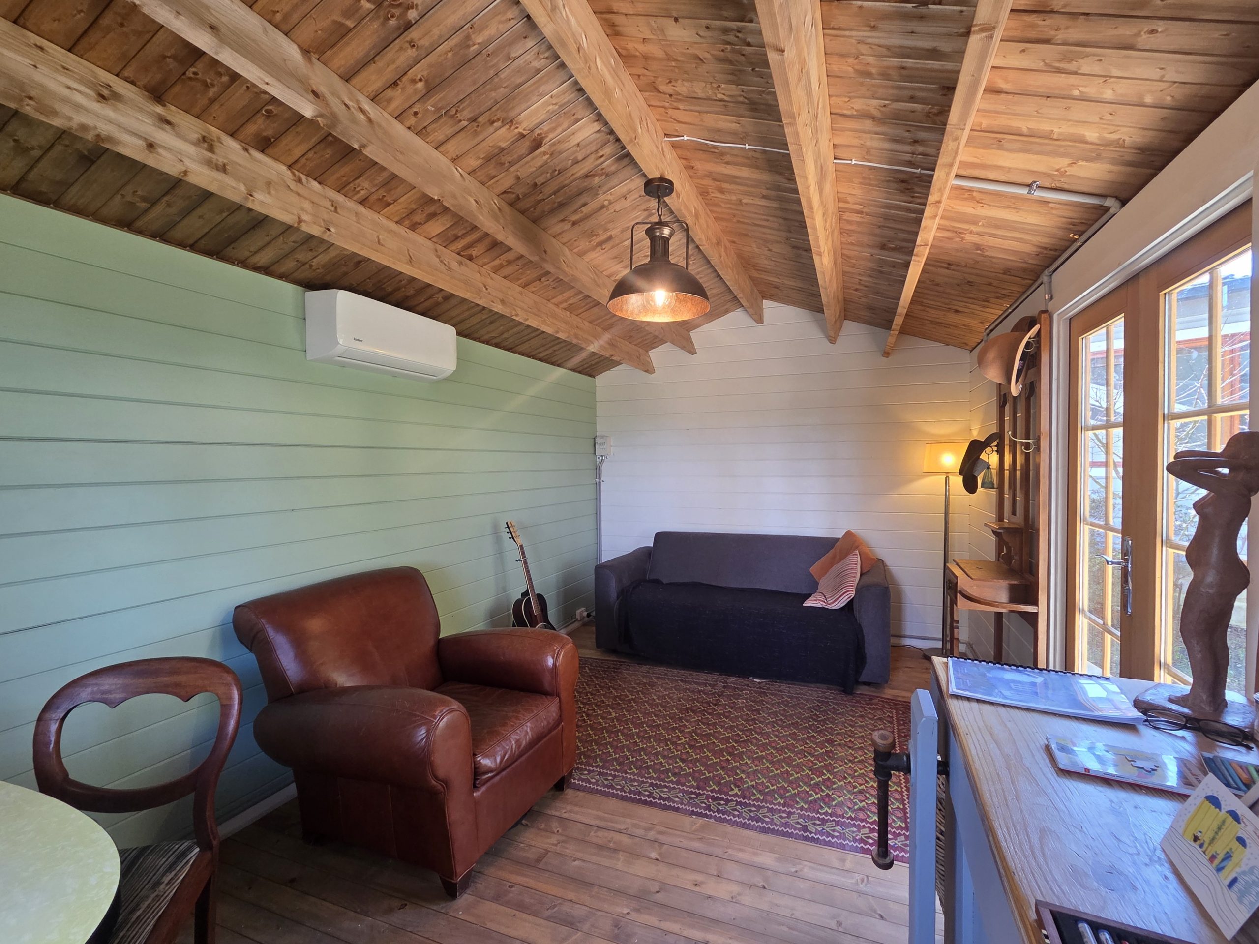 inside woodland cabin used as backyard retreat with pendant light