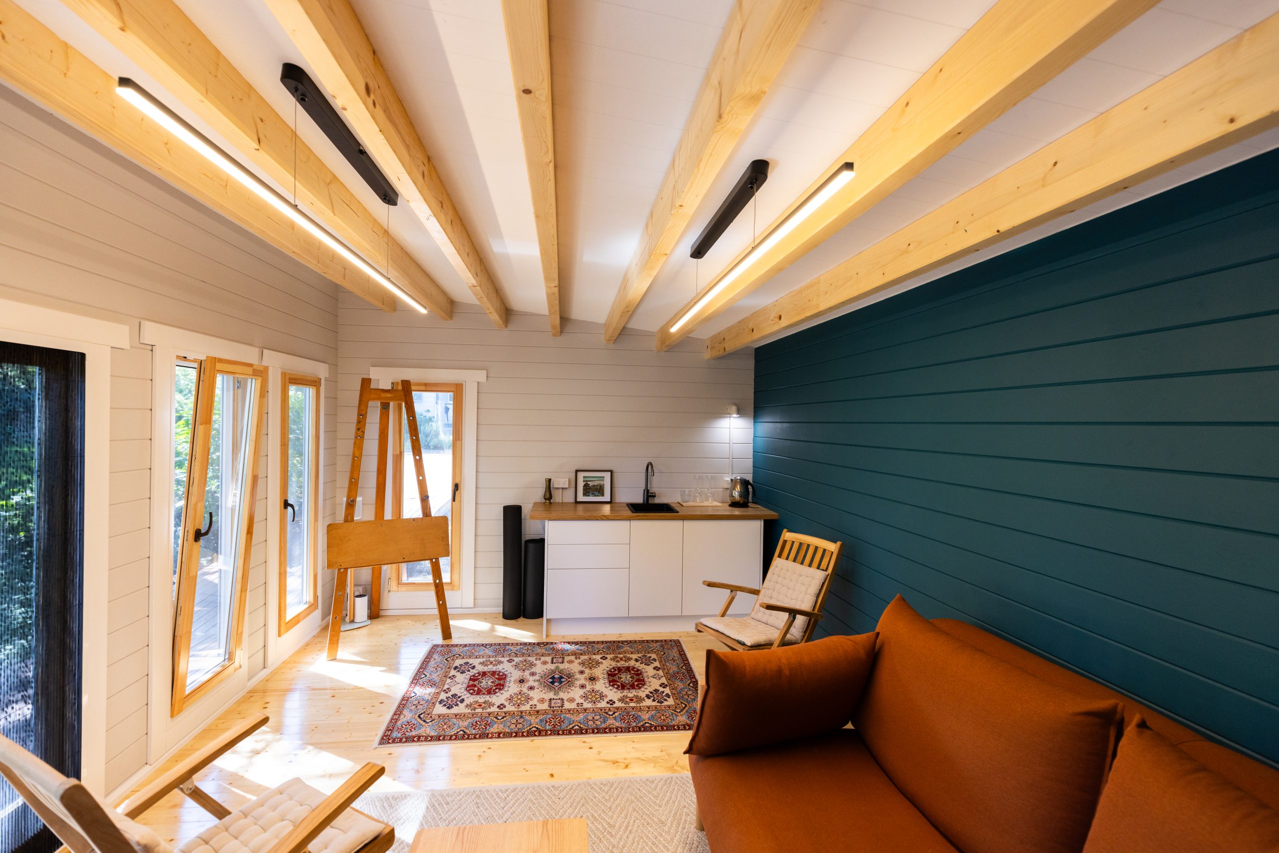 inside of alpine cabin art studio with tilt and turn windows