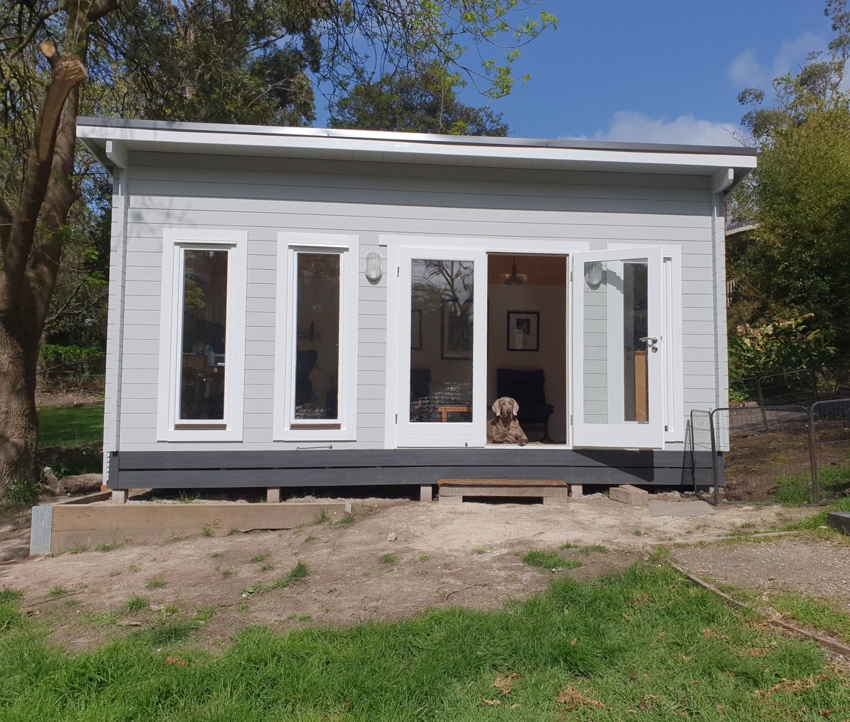 outside of alpine cabin home office with door open