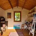 inside cabana cabin art yoga studio with single top hung window and two casement windows