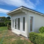 outside of painted coastal cabin homeoffice