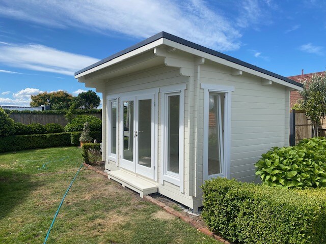 outside of painted coastal cabin homeoffice