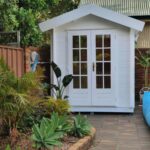 White portable garden room for pool supplies