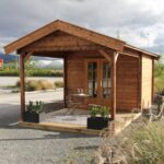 outside of unpainted star canopy display cabin styled as a backyard retreat