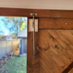 inside painted tasman display cabin with close up of barn door