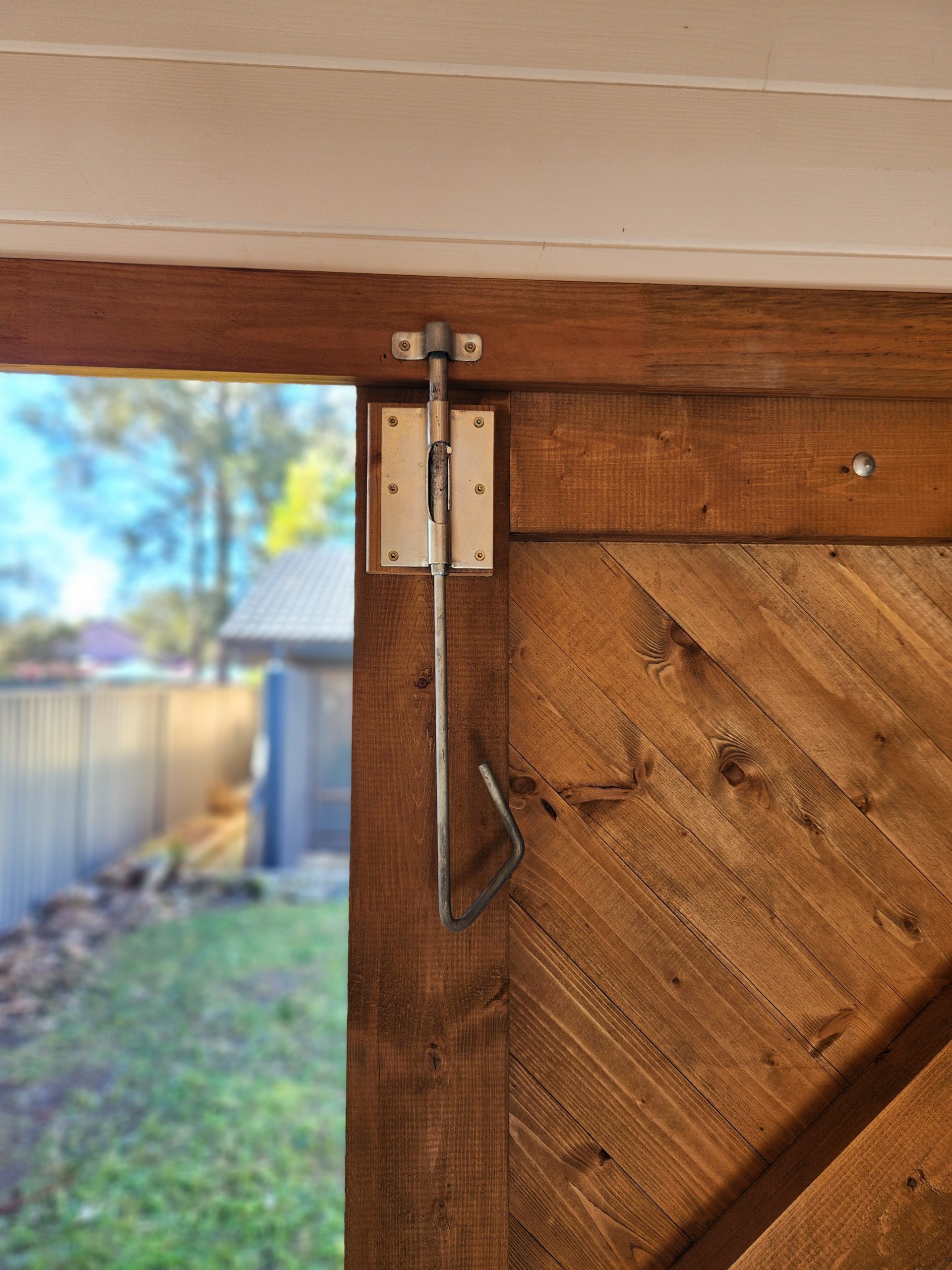 inside painted tasman display cabin with close up of barn door