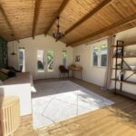 inside painted tasman display cabin with part fixed long window and fixed vented windows and french doors and double windows