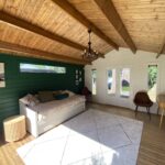 inside painted tasman display cabin with part fixed long window and fixed vented windows and french doors