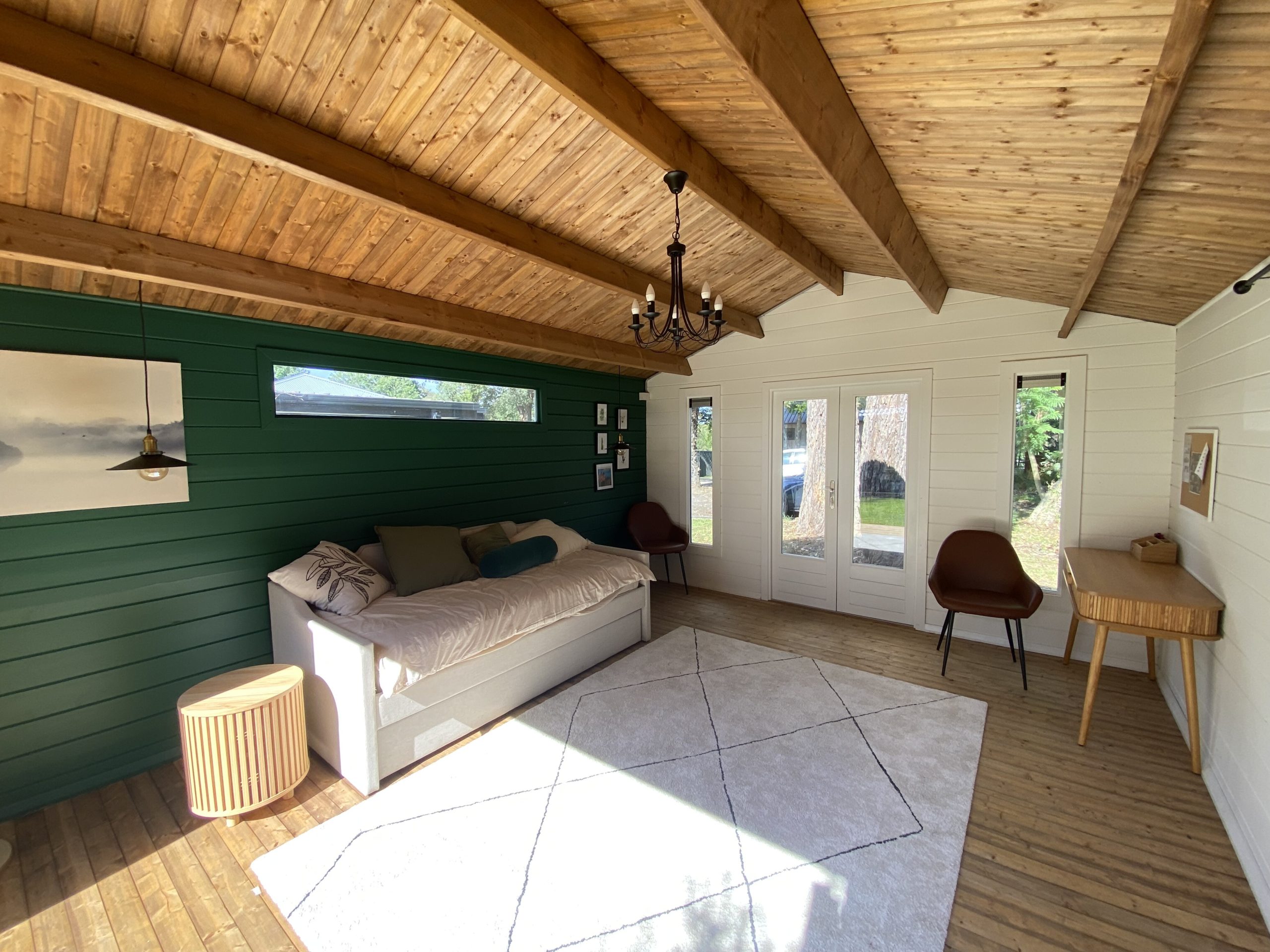 inside painted tasman display cabin with part fixed long window and fixed vented windows and french doors
