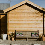 side of lake cabin as an upholstery studio