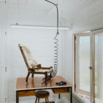 inside lake cabin with white painted walls and ceiling
