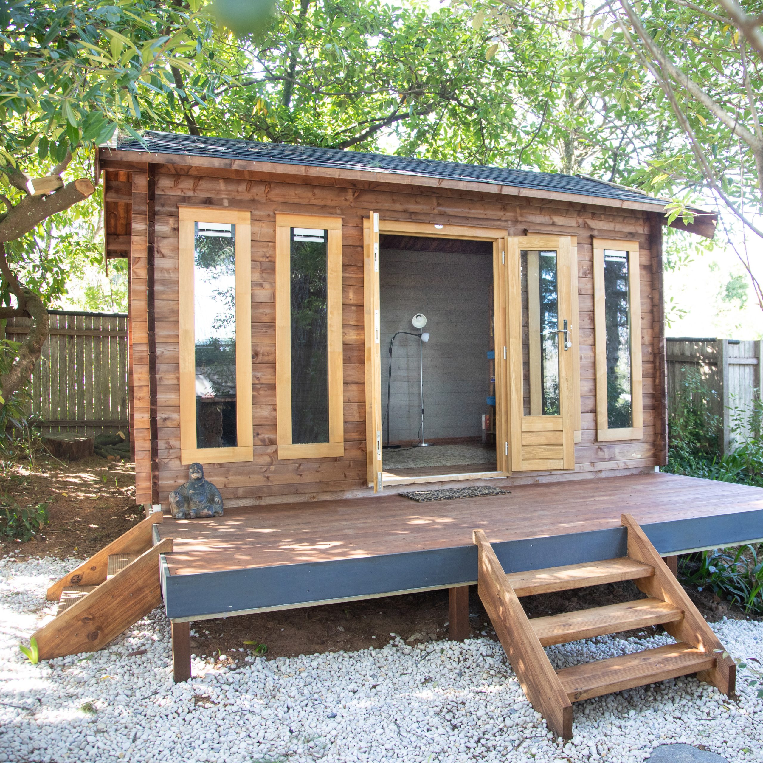 outside of ranch cabin as a backyard retreat with a deck