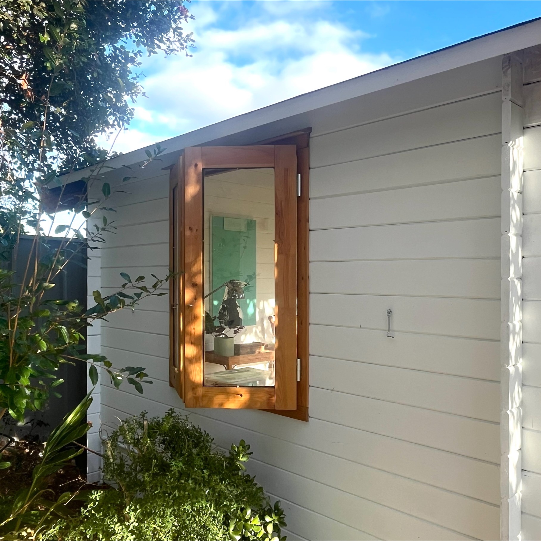 Outside of star cabin home office with casement window