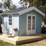 outside of painted star cabin sleepout with french doors and deck