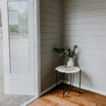 inside of painted star summit display cabin home office with open french door