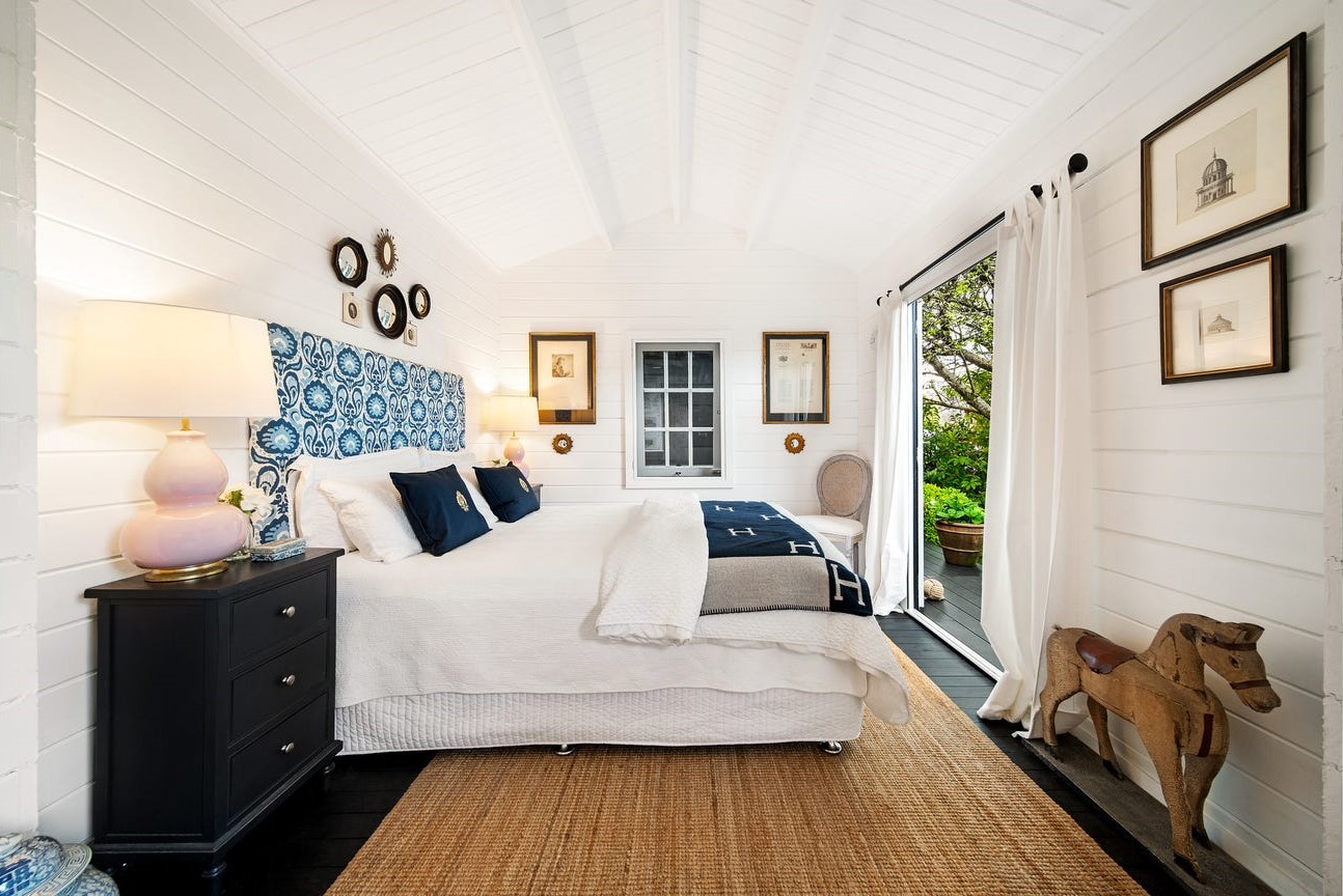 inside of star deluxe sleepout cabin with casement window and open doors