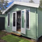 outside of tasman display cabin with one door open