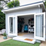 outside of painted tussock cabin bike storage with opendoor