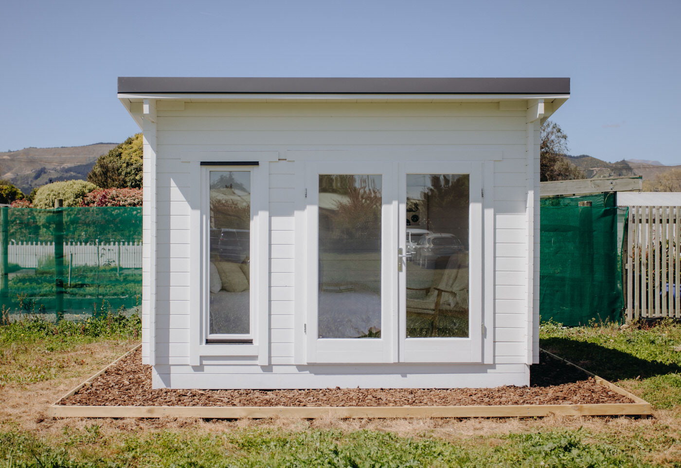 outside of painted tussock display cabin home office