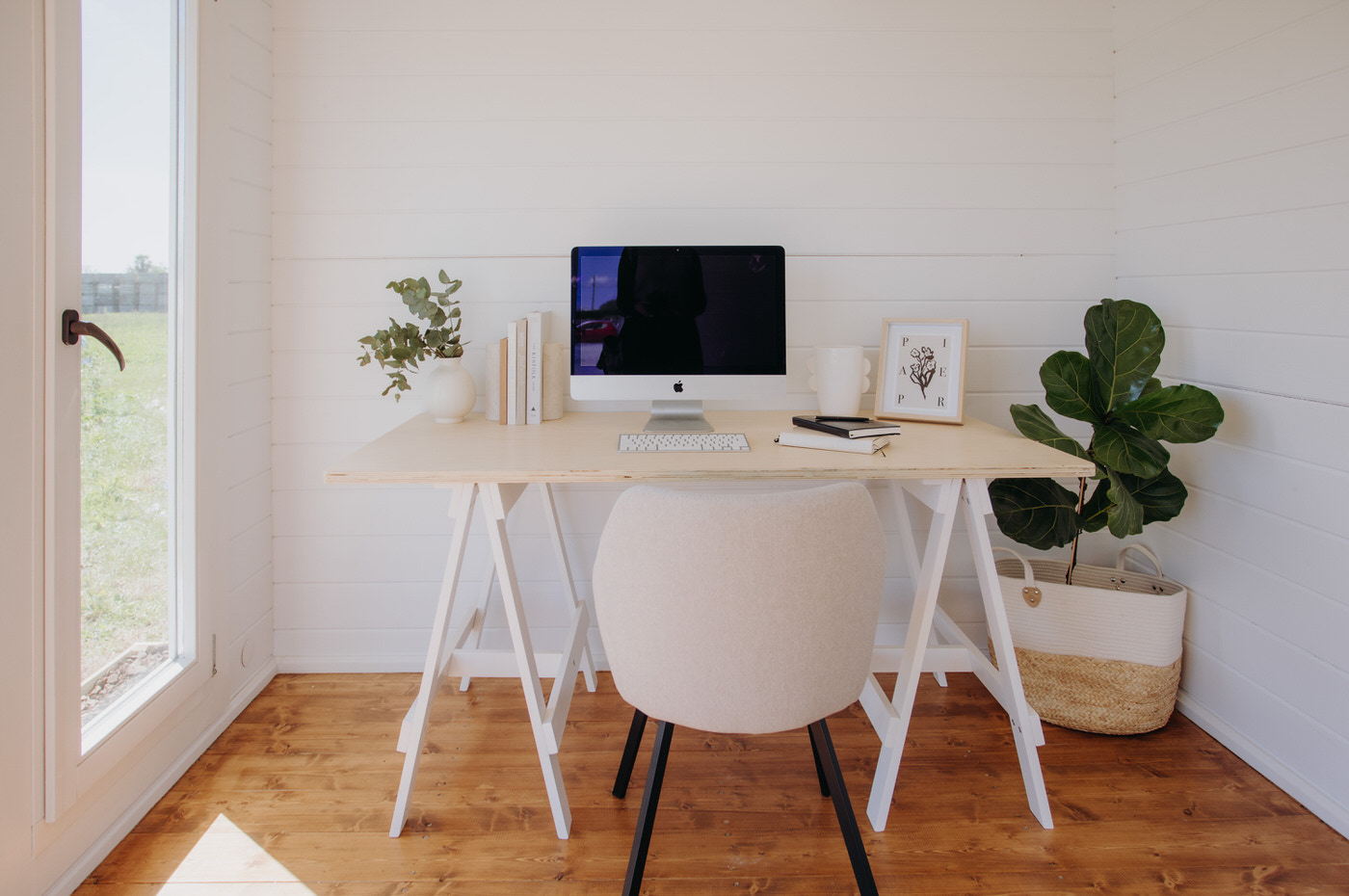 inside painted tussock display cabin home office with desk