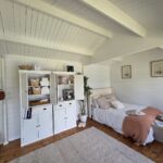 inside of painted and styled display brook river cabin used as scandi style accomodation and retreat