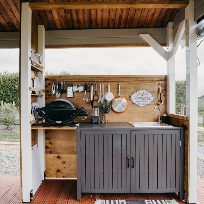 outside of cabana canopy cabin bee valley farm business