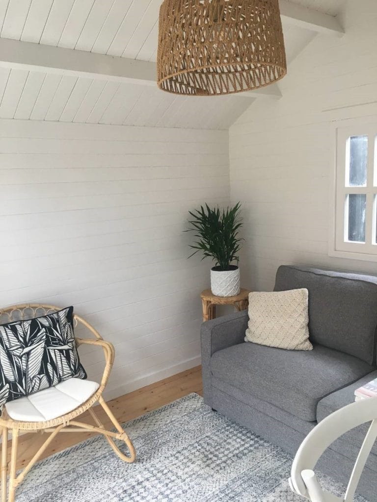 couch and chair in a wooden studio
